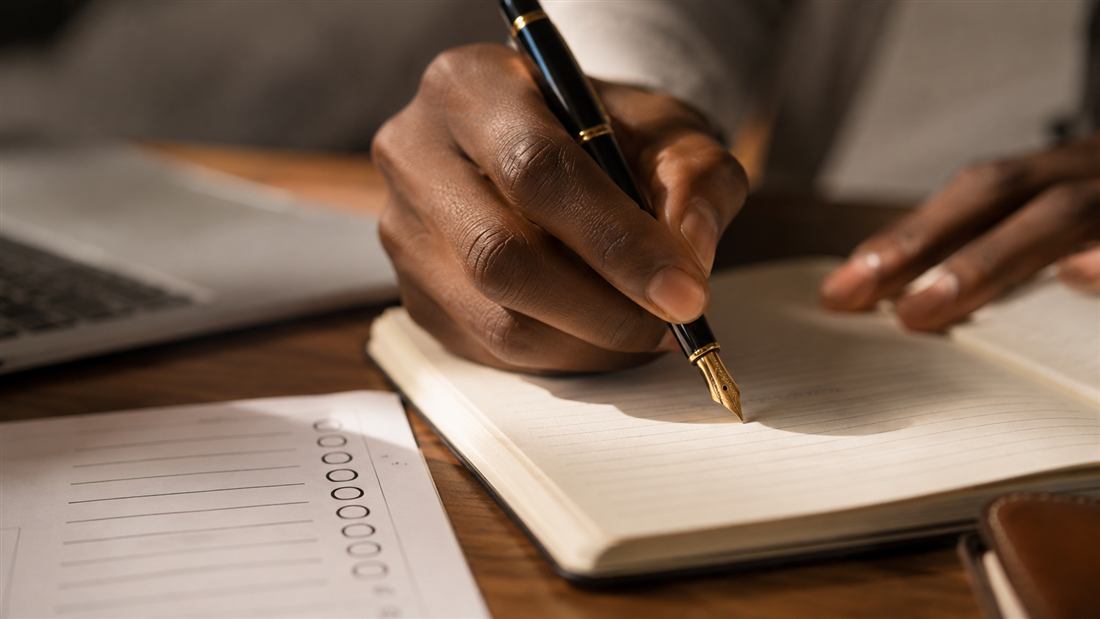 Notebook and pen for personal story planning